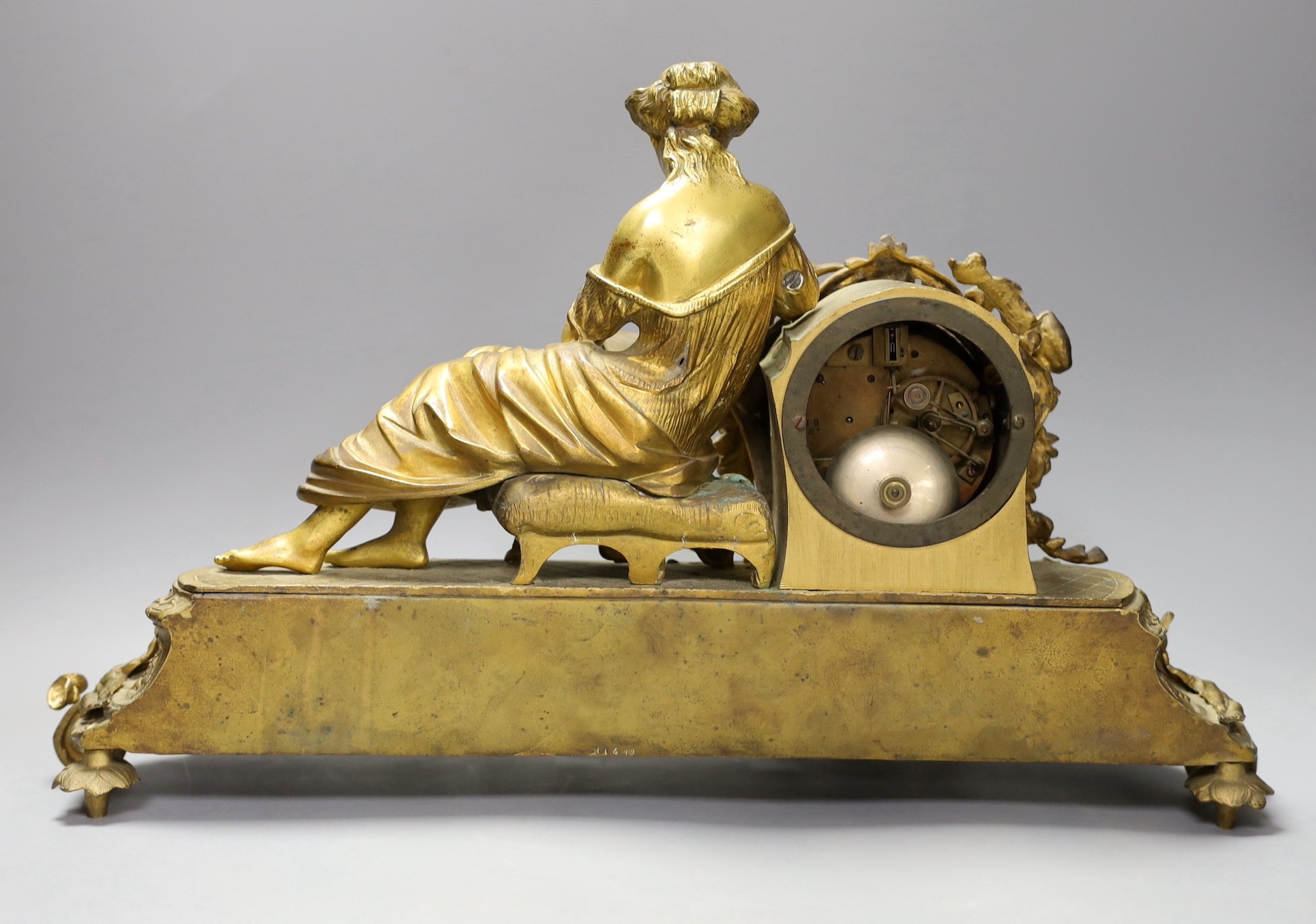 A 19th century French gilt metal figural mantel clock, with porcelain floral panels, 30cms high.